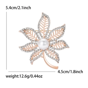 Elegant maple leaf brooch with crystal rhinestones and center pearl on gold base