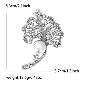 Detailed view of silver leaf brooch with pearl and crystals measuring 5.3cm by 3.7cm
