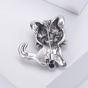 Vintage silver cat brooch with secure safety pin clasp shown from the back view