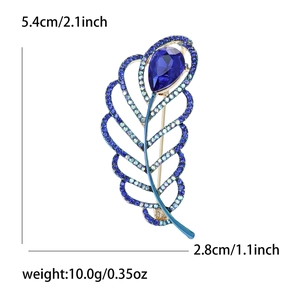 Elegant leaf-shaped brooch with blue crystals and rhinestones, size 5.4cm by 2.8cm
