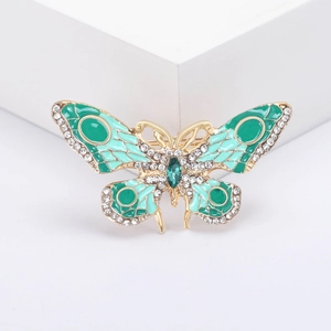 Broche papillon exquise avec émail vert et cristaux étincelants sur alliage doré brillant