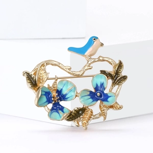Elegant Chinese style flower and bird brooch with blue enamel and gold finish