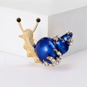 Elegant gold snail brooch with blue enamel shell and sparkling white crystal rhinestones