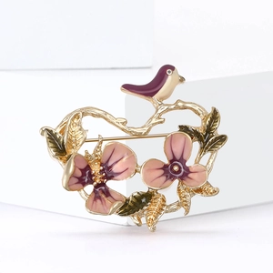 Elegant Chinese style floral and bird brooch with pink enamel petals and gold finish