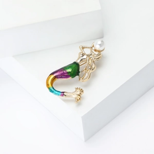 Golden mermaid brooch with colorful enamel gradient fishtail and a white pearl accent
