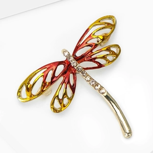 Enamel dragonfly brooch with gold finish, vibrant orange gradient wings and sparkling rhinestones