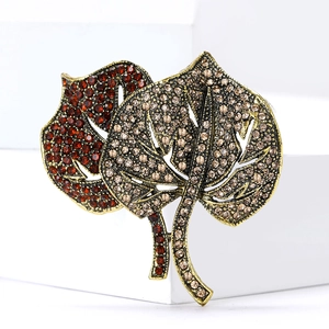 Luxury rhinestone leaf brooch with vintage gold base featuring red and champagne crystals