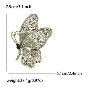 Vintage gold butterfly brooch with green and blue crystals, size 7.9cm x 6.1cm