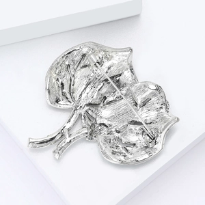 Detailed back view of silver leaf brooch showing fine metal veins and pin clasp structure