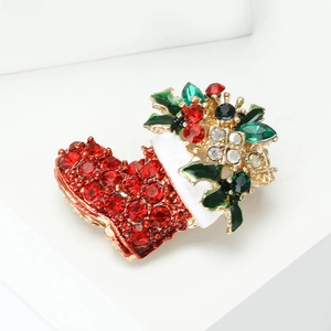 Sparkling Christmas boot brooch with red rhinestones and white enamel in gold plating