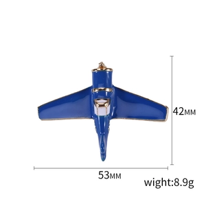 Navy blue airplane brooch in metal alloy with gold trim, size 53mm by 42mm