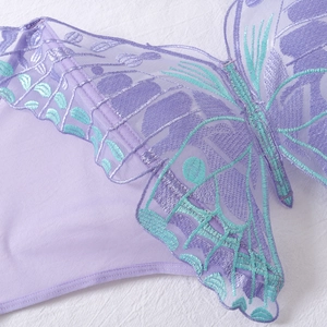 Close-up of butterfly embroidery on sheer lilac mesh lingerie set for women