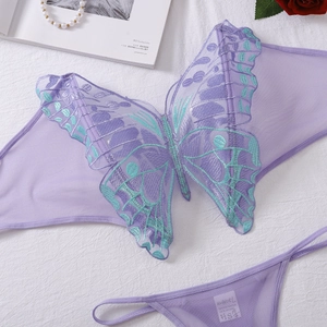 Detailed embroidery of green butterflies on a purple mesh lingerie set with lace accents
