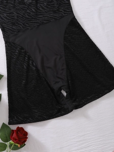 Detail of sexy black mesh bodysuit with zebra pattern and hollow lace-up design