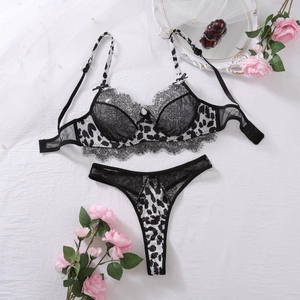 Lace detail on leopard and cow print lingerie set with underwire cups and bow accents