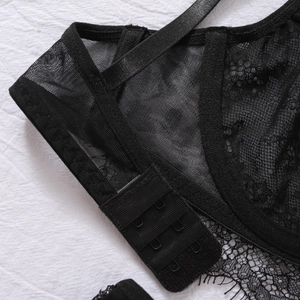 Detail shot of the black lace lingerie set featuring three-row hook-and-eye back closure