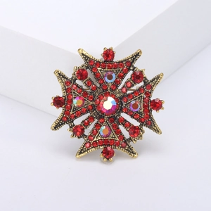 Vintage Maltese cross brooch with red rhinestones and gold-plated alloy finish