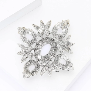 Detailed close-up of the vintage silver alloy brooch back with secure pin and hollow craft
