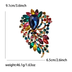 Élégante grande broche en cristal de verre vintage avec pierre bleue et base en alliage doré