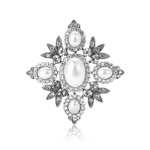 Vintage Baroque brooch with large oval pearl and rhinestones on a silver metal frame