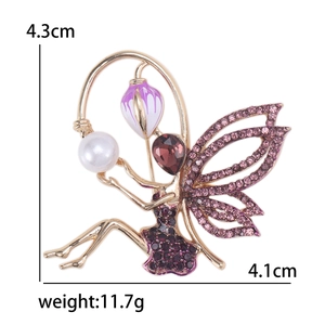 Golden alloy fairy brooch with purple crystals and white pearl accent for elegant clothing