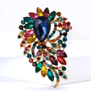 Broche élégante en alliage doré avec grand cristal bleu et pierres multicolores