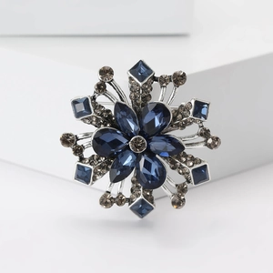 Exquisite snowflake brooch with dark blue and gray rhinestones on vintage silver alloy