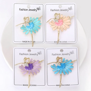 Set of four ballet dancer brooches with daisy petal skirts in blue, pink, and purple