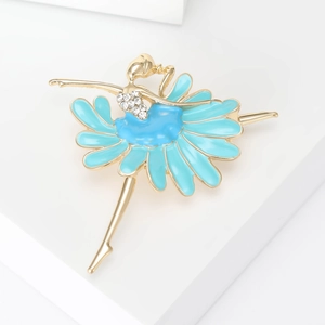 Detail of ballet dancer brooch with light blue enamel skirt and white rhinestone accents