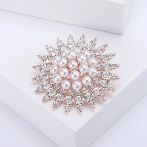 Detail of sunflower pearl brooch with sparkling crystals and rose gold plated alloy base