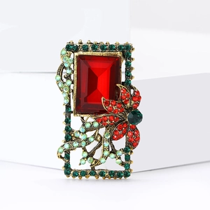 Baroque vintage rectangular red crystal brooch with gold floral vine detail and rhinestones