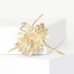Elegant gold ballerina brooch with textured alloy finish and secure pin back closure