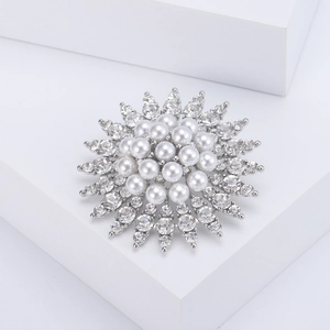 Elegant silver sunflower brooch with lustrous white pearls and sparkling rhinestones