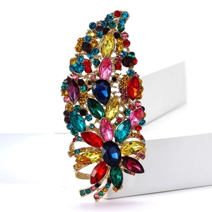 Macro detail of luxury alloy brooch with multi-colored crystals and vibrant rhinestones