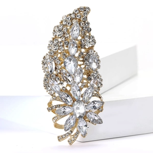 Macro shot of leaf brooch with gold alloy base and sparkling rhinestone crystals