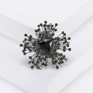 Irregular geometric crystal flower brooch with black triangular stone in gunmetal finish