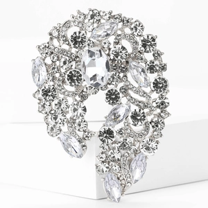 Close-up of elegant silver alloy flower brooch with sparkling clear crystals and rhinestones
