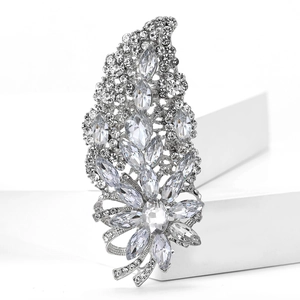 Detailed view of silver alloy brooch featuring sparkling crystal clusters and marquise stones