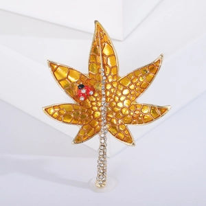 Elegant gold maple leaf brooch with yellow enamel, small ladybug and sparkling crystals