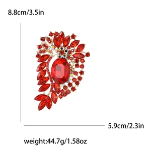 Vintage gold brooch with large red oval gemstone and floral rhinestones, 8.8cm tall