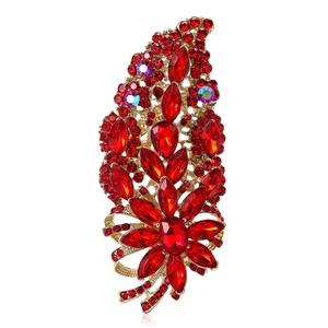 Vintage gold alloy brooch featuring luxury red crystals in a floral leaf design