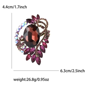 Vintage alloy brooch with red crystals and dimensions showing 6.3cm height and 4.4cm width