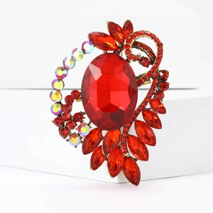 Elegant vintage red ruby brooch with sparkling crystals in a golden baroque design
