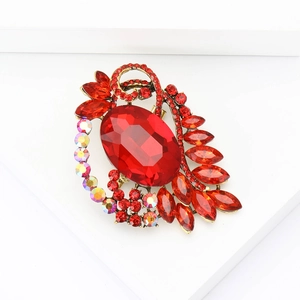Vintage gold alloy brooch with large red oval gemstone and marquise rhinestones