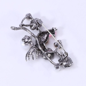 Vintage silver bird and branch flower brooch with pearl accents, rear pin view