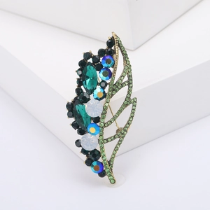 Elegant gold leaf brooch with emerald crystals and sparkling rhinestones for women
