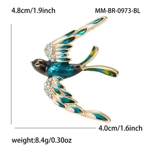 Broche hirondelle élégante avec émail bleu et strass, dimensions 4,8cm par 4,0cm