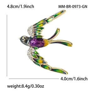 Broche hirondelle en émail coloré avec strass brillants et base dorée élégante