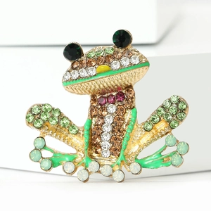 Vintage green frog brooch with gold finish, sparkling rhinestones, and enamel accents