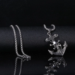 Punk style stainless steel anchor necklace with skull pendant on black leather background